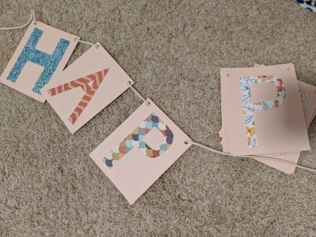 Happy Birthday Cut Letter Banner - stringing the letters for the banner