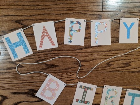 Happy Birthday Cut Letter Banner - all of the letters strung on the cord
