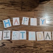 Happy Birthday Cut Letter Banner - finished banner lying on the floor