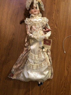 Value of a Dynasty Porcelain Doll? - doll wearing a long ivory trimmed dress perhaps Victorian style