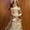 Value of a Dynasty Porcelain Doll? - doll wearing a long ivory trimmed dress perhaps Victorian style