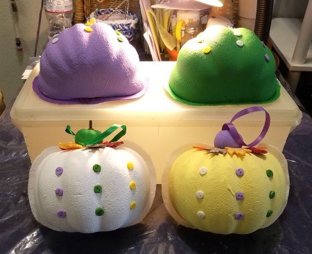 Non-Traditional Foam Pumpkin Halves - pumpkin halves sitting on top of and leaning on the front of a plastic box