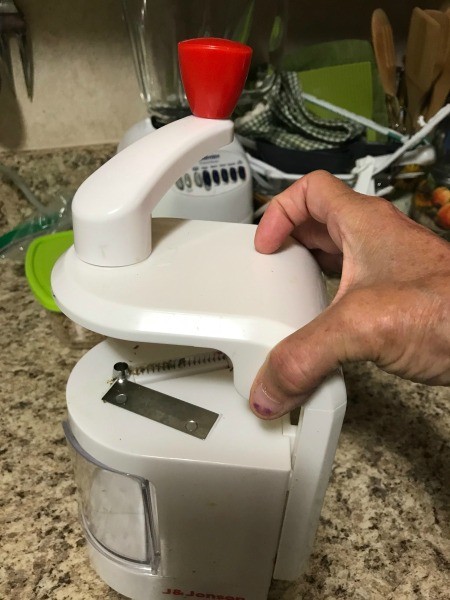 A spiralizer on a countertop.