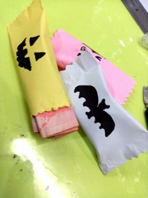 Trick or Treat Candy Surprise Paper Wraps - 3 wraps, one monster face, a bat, and perhaps a Frankenstein monster