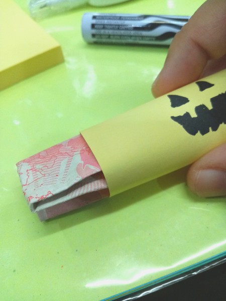Trick or Treat Candy Surprise Paper Wraps - sliding paper money into the wrap