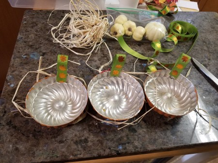 Mini Baking Tin Pumpkins - gluing raffia to the tins