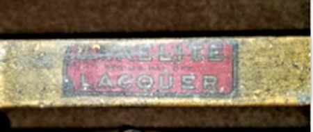 A label on a brass bed.