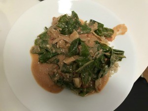 A plate of chicken curry over rice.