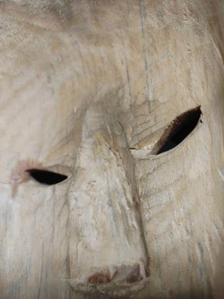 The inside of a wooden mask.