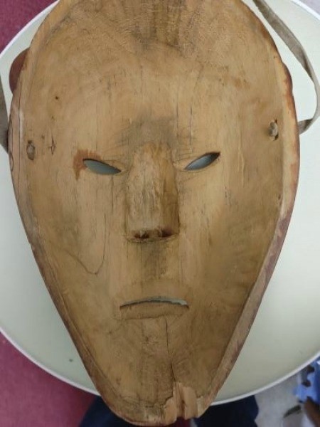 The inside of a wooden mask.