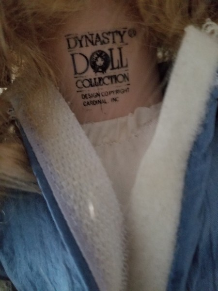 The marking on the back of a doll's neck.