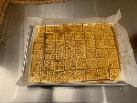 Halloween Saltine Toffee - sugar and butter mixture poured over the crackers