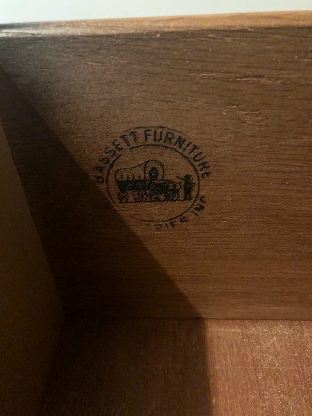 A marking inside a dresser drawer.