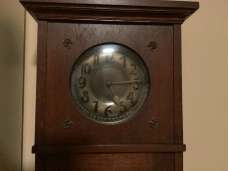 The face of a grandfather clock.