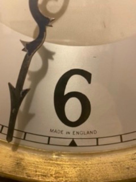 Close up of clock face on grandfather clock.