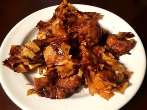 A plate of baked cinnamon sugar nests.