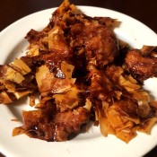 A plate of baked cinnamon sugar nests.