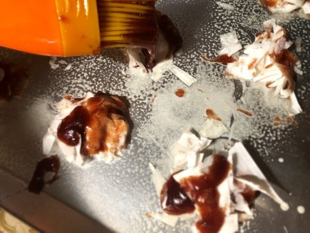 Covering the phyllo dough with the cinnamon sugar mixture.