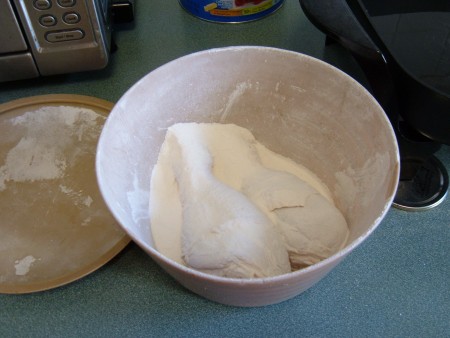 Chicken legs dredged in flour.