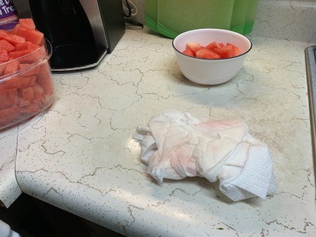 Cleaning the messy countertop.