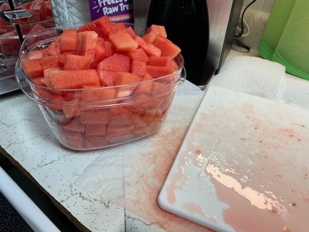 A container full of watermelon chunks.