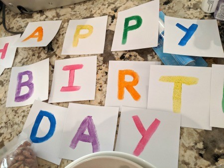 Painted Happy Birthday Banner - letters painted on the paper squares