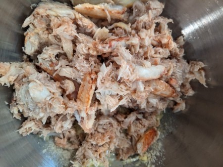Adding crab to the mixture.