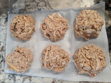 Making uniform patties of the crab mixture.