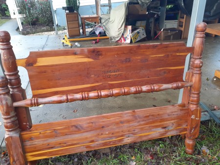 A wooden head and footboard to a bed.