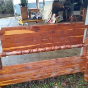 A wooden head and footboard to a bed.