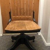 A vintage wooden desk chair.