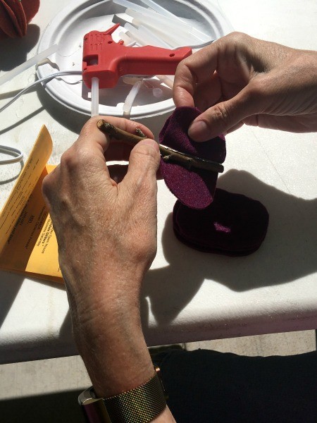 Five Minute Felt Pumpkin - better photo of gluing felt shapes to twig