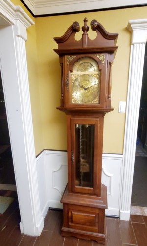 A tall wooden grandfather clock.