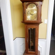 A tall wooden grandfather clock.