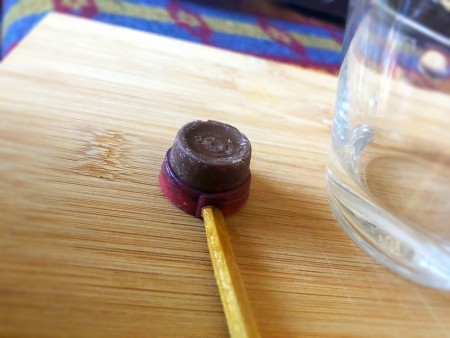 Chocolate Cowboy Hats - using a chopstick to press the end of the fruit rollup around the Rolo