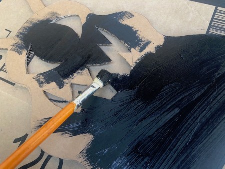 Cardboard Window Monster - painting the monster black