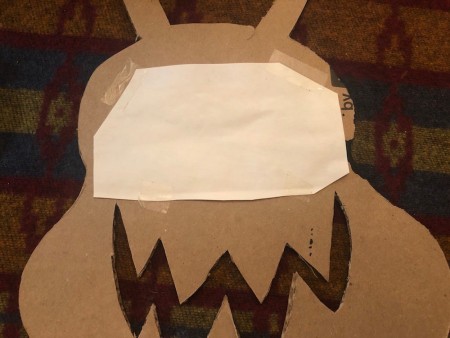 Cardboard Window Monster - cut yellow paper to fit behind the eye cutout and tape to the unpainted side