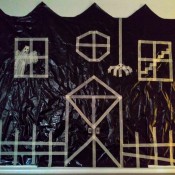 Big Garbage Bag Hanging Haunted House - finished house complete with picket fence and spider hanging down