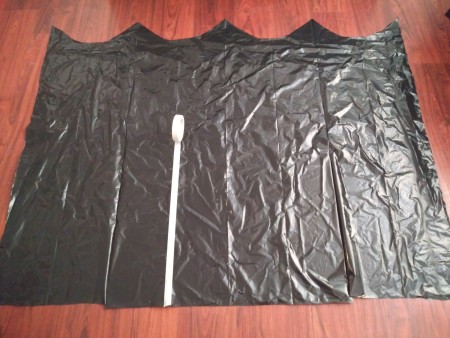 Big Garbage Bag Hanging Haunted House - cut triangles along the top and begin designing with tape