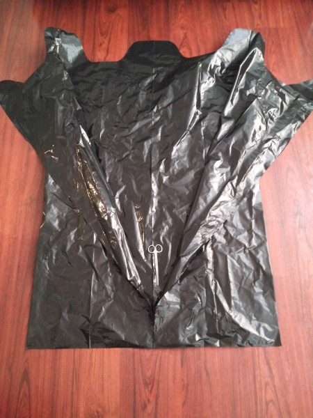 Big Garbage Bag Hanging  -Haunted House - cut down the center of the top layer