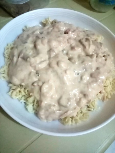 The carbonara mixture served over noodles.