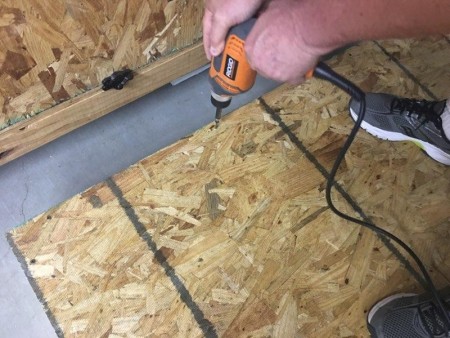 Garden Bed from Recyled Bed Frame  - drilling OSB to attach to the wood frame