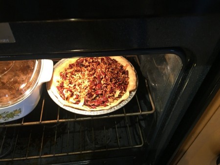 The tart baking in an oven.