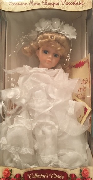 A bridal porcelain doll in a box.