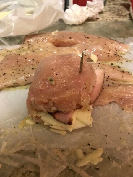 Holding the chicken stack closed with a toothpick.