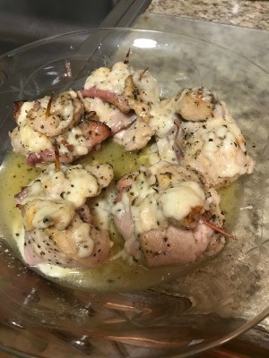 A plate of cooked chicken cordon bleu.