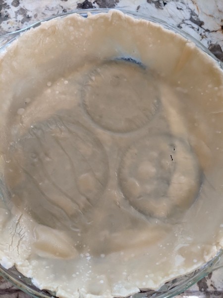 A baked piecrust, ready for filling.