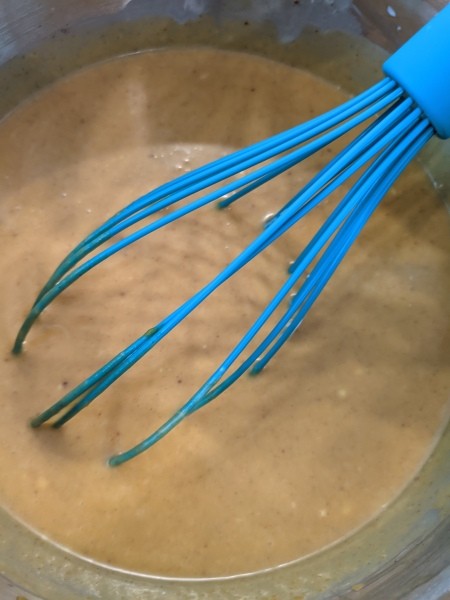 Mixing up the pumpkin pie filling.