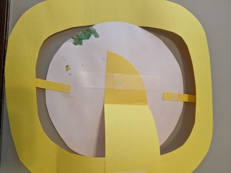 Saturn Hanging Decoration - back side of the planet showing scrap paper holding it in place