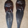 Carved wooden masks with long beards.